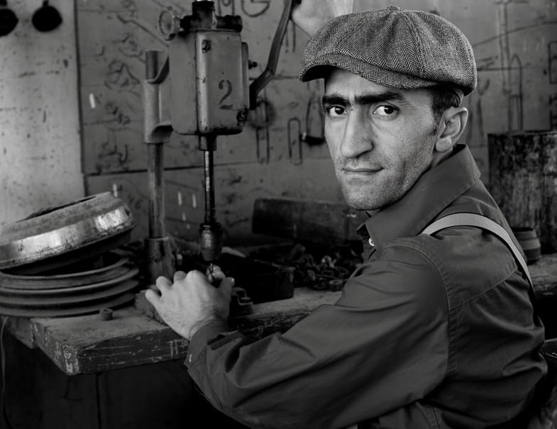 Maintenance worker in garage black and white photo